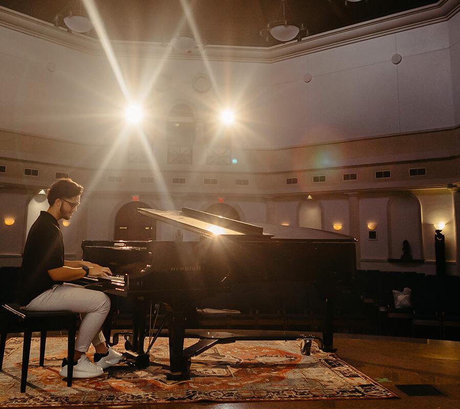 a student from the major in instrument performance playing the piano